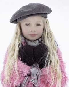 little girl playing dress up